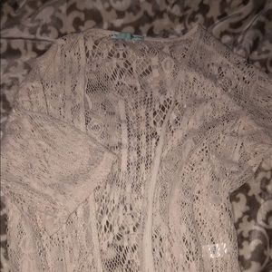 Lacy cream-colored cardigan.